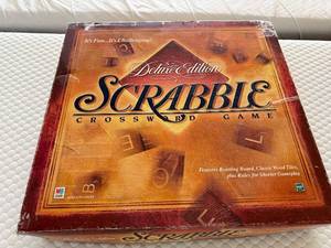 lot 142 image: Scrabble Deluxe Edition Crossword Game - Rotating Board, Wood Tiles, 4 Tile Racks