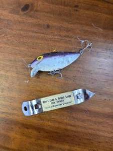 lot 58 image: Purple Rapla & vintage advertise bottle opener.