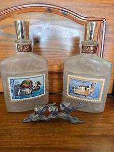 lot 73 image: Spelter pot metal owls and DU Jim Beam decanters