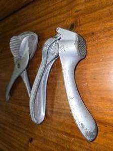 lot 114 image: Vintage garlic press and lemon squeezer