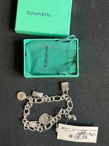 lot 7 image: Tiffany & Co. Sterling Silver Charm Bracelet with Box and Pouch- no signature T at clasp