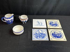 lot 137 image: Assorted Decorative Blue and White Ceramic Lot with Creamer, Sugar Bowl, and Dutch Tiles Inc McClaine
