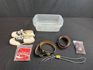 lot 94 image: Vintage Saddle Shoes, Coca-Cola Patch, Leather Belts, Bolo Tie, and Storage Bin Assortment