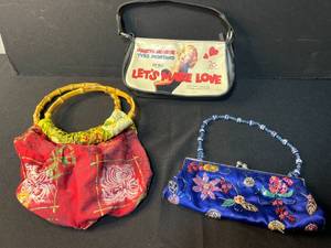 lot 179 image: Set of 3 Womens Handbags - Marilyn Monroe Purse, Beaded Blue Clutch, Red Bamboo Handle Bag