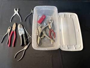 lot 203 image: Box of Assorted Hand Tools including Pliers, Cutters, and Multi-Tool