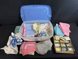 lot 251 image: Vintage Gingham Aprons, Handkerchiefs, and Button Lot in Storage Tote