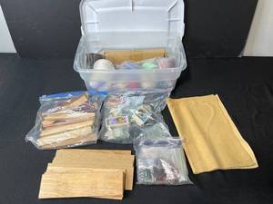 lot 276 image: Craft Supplies Lot with Wood Pieces, Fabric, Beads, and Accessories in Storage Bin