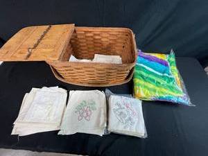 lot 310 image: Vintage Woven Picnic Basket with Embroidered Tea Towels and Linens