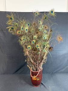 lot 315 image: Large Arrangement of Peacock Feathers in Vintage Leather Fire Bucket Vase