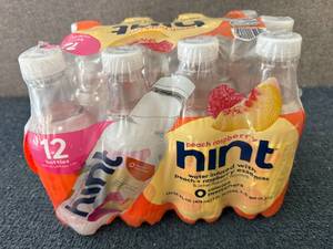 lot 113 image: 12 Bottles Of Hint Peach Raspberry