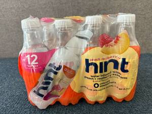 lot 114 image: 12 Bottles Of Hint Peach Raspberry
