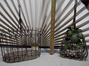 lot 21 image: The image shows two vintage metal baskets,