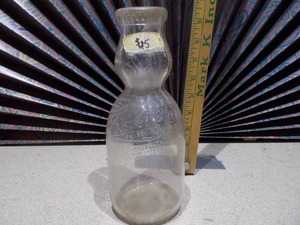 lot 47 image: This is a vintage glass milk bottle.
