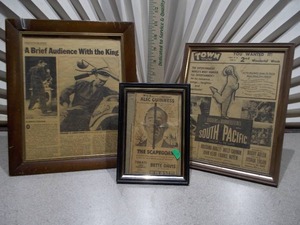 lot 52 image: These are framed vintage newspaper clippings or movie lobby cards