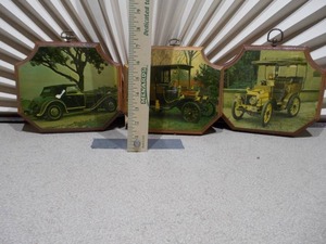 lot 62 image: These are vintage wall plaques featuring art of antique cars