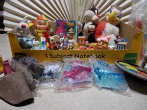 lot 80 image: The image displays a collection of vintage fast-food toys, primarily from McDonalds Happy Meals, which are considered collectibles.