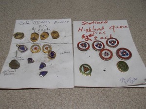 lot 103 image: This image displays a collection of assorted vintage enamel pins