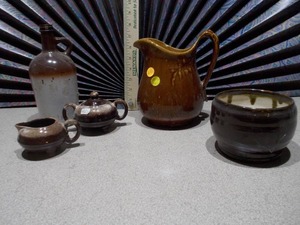 lot 111 image: This is a collection of vintage brown drip glaze pottery,