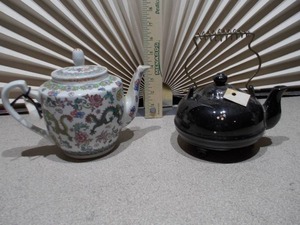 lot 112 image: Chinese Famille Rose teapot and a second, black glazed teapot,