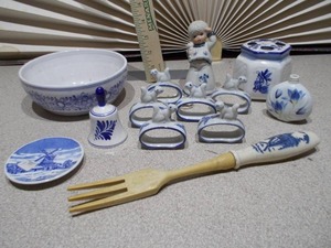 lot 140 image: The image displays a collection of Delft blue and white ceramic items