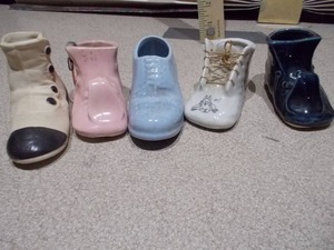 lot 141 image: These items are vintage ceramic baby shoe planters