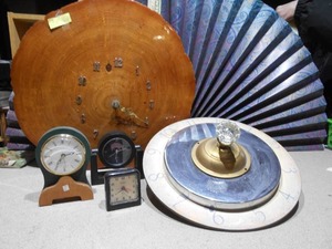 lot 156 image: The image displays several clocks,