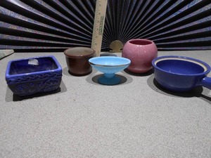 lot 163 image: These are a collection of miniature ceramic vases and planters, likely vintage Shawnee pottery items.