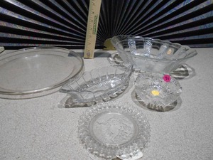 lot 164 image: This is a collection of vintage or antique clear glass dishes