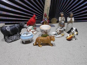 lot 165 image: The image displays a collection of various ceramic figurines