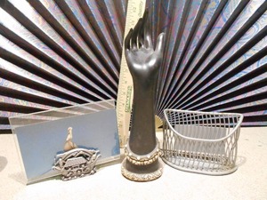 lot 169 image: A dark, hand-shaped sculpture