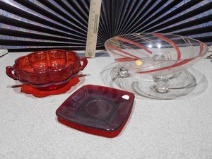 lot 173 image: The image displays a collection of ruby red glass collectible items,