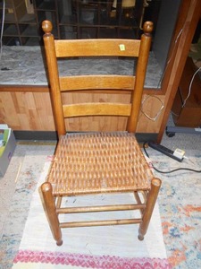 lot 186 image: This is a Shaker-style ladder back side chair with a woven rush seat