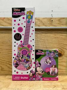 lot 140 image: Disney Junior Minnie guitar and hopper (lot of 2)
