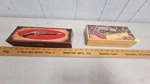 lot 45 image: Pair of Firearm Themed Avon Cologne Bottles wboxes