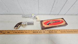 lot 47 image: 3 Firearm Themed Avon Cologne Bottles, one still in box