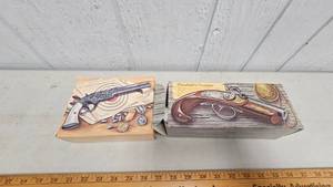 lot 49 image: Two Firearm Themed Avon Cologne Bottle