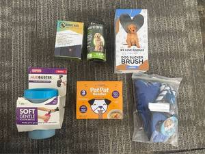 lot 251 image: Sonic Anti Bark Control Device - Pet Lot We Love Doodles Slicker Brush, MudBuster, Pat Pat Noodles, Rope Toy, Pet Sign