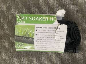 lot 366 image: Flat Soaker Hose - 5 ft  15 m Black Coil with Instruction Sheet