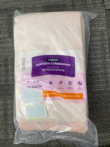lot 427 image: Premium Disposable Underpads - 30 in L x 36 in W - 25 Pack with Adhesive Strips