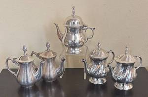lot 163R image: Five Silver-Plated Teapot Candle Holders