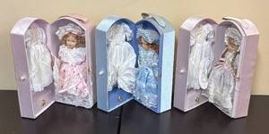 lot 195R image: LR - Three Collectible Dolls in Pastel Lace Dresses with Display Cases