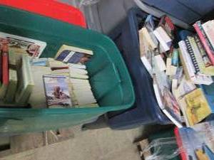 lot 32 image: Covered tote filled with books...