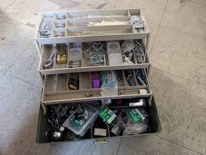 lot 122 image: Plano box filled with assorted hardware and useful items