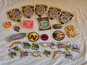 lot 75 image: Police and Scout Patches, Keychain, and Memorabilia Collection including Minnesota New Hope Police Patches, Clan MacNaghten Keychain, and Boy Scouts Items
