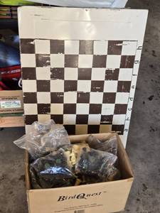 lot 84 image: Box Full of Chess Pieces and Metal Chess Board