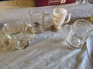 lot 116 image: Glass Mugs and Cup Lot including Disneyland Jack Mug, Florida Mug, and Other Glassware
