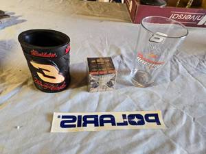 lot 120 image: Dale Earnhardt Collectibles including The Intimidator Tire Mug, Budweiser Racing Glass, and Chevy Dealers Rubiks Cube, Polaris Sticker