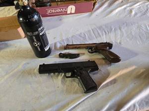 lot 129 image: Daisy Powerline 201 Dual Ammo CO2 BB Gun, Crosman 22 Pistol, and CO2 Cylinder