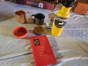 lot 130 image: De Luxe Official Bartenders Guide book, Crescent powder container, Tettegouche State Park Water Bottle and More