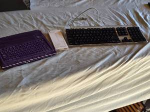 lot 148 image: USB-C to Digital AV Multiport Adapter, Wired Keyboard, and Purple Bluetooth Keyboard